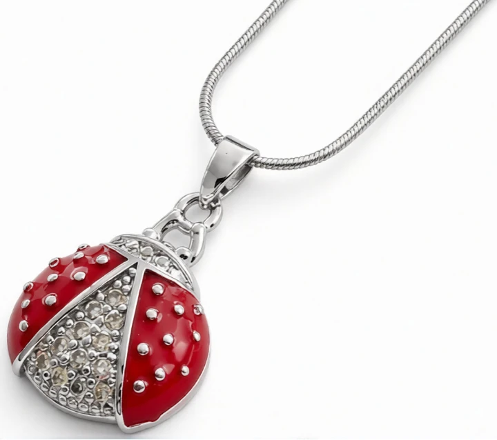 Cadena de acero quirurgico con dije vaquita de san antonio roja con micro pave cristal 40cm + 5cm